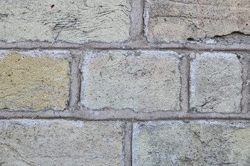 Full frame pale sandy brick wall background with copy space