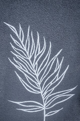 Palm branch white graphic on gray textured background. - 593643919