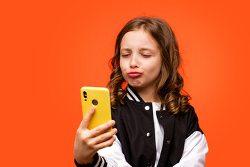 Teenage school girl with smartphone