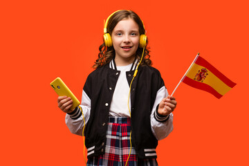 Girl holds small flag Spain