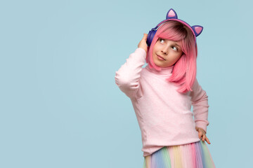 Preteen girl in pink wig