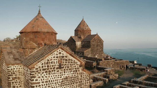Exploring Armenia, aerial drone view of Sevanavank monastic complex full of tourists