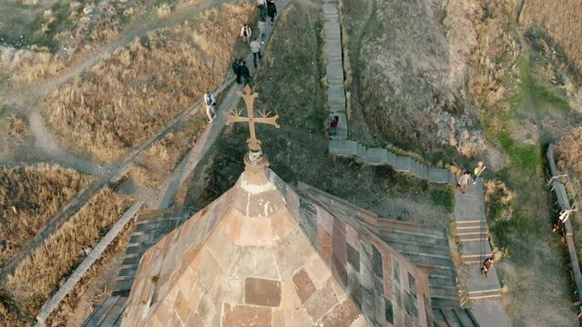 Top view and the dome of Surp Astvatsatsin church in Sevanavank monastic complex shot with nice drone movement