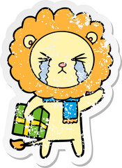 distressed sticker of a cartoon crying lion