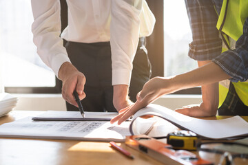 Builder team, hand of asian, caucasian young engineer, architect two man are discussing...