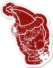 cartoon distressed sticker of a happy hipster girl wearing santa hat