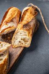 baguette long white bread whole wheat flour, wheat bread, sourdough meal food snack on the table copy space food background rustic top view