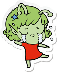 sticker of a cartoon crying alien girl