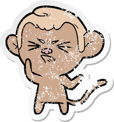 distressed sticker of a cartoon annoyed monkey