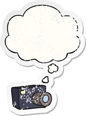 cartoon camera and thought bubble as a distressed worn sticker