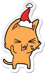 sticker cartoon of a cat hissing wearing santa hat
