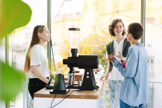 Young Couple is Making Order in Cafe 