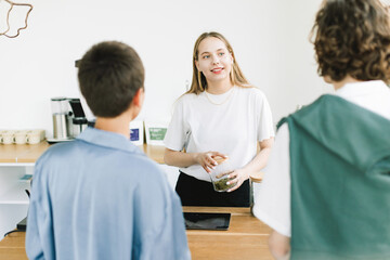 Clients Meet Blonde Female Administrator at Her Desk