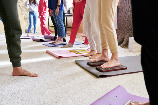 Many people standing on nails practicing