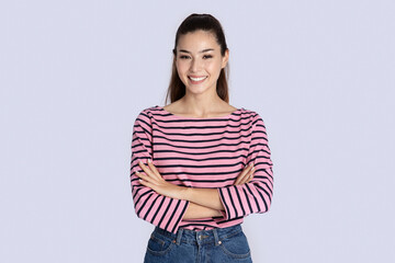 Fototapeta premium Portrait of confident cheerful pretty young brunette woman