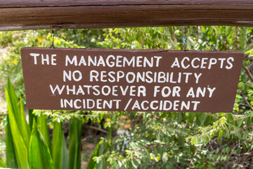 Sign - The Management accepts no responsiblity for any incident or accident - posted at a hotel resort to avoid getting sued - obrazy, fototapety, plakaty
