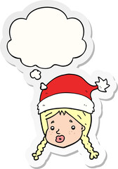 cartoon girl wearing christmas hat and thought bubble as a printed sticker