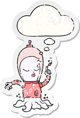cute cartoon alien and thought bubble as a distressed worn sticker