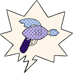 cartoon ray gun and speech bubble in comic book style