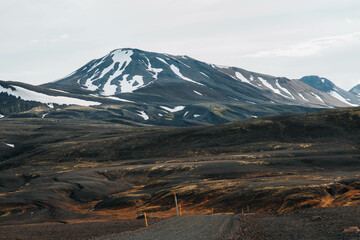 Epic north landscape with snowy mountains and brown desert