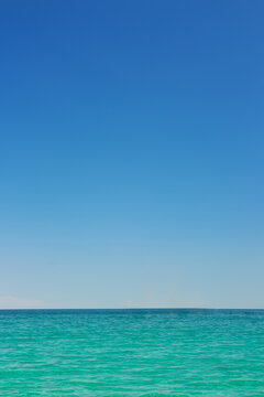 Beautiful idyllic seascape with blue sky. Clear sky and calm sea or ocean water surface background
