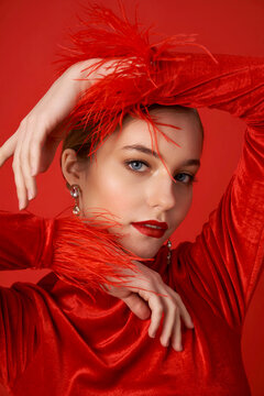 Portrait of a beautiful smiling woman in red