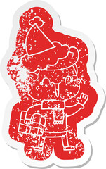 cartoon distressed sticker of a laughing boy wearing santa hat