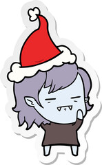 sticker cartoon of a undead vampire girl wearing santa hat