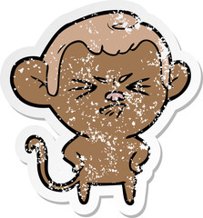 distressed sticker of a cartoon annoyed monkey