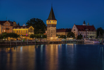 Night view of the picturesque port of Lindau with the Mangenturm tower., Bavaria, Germany