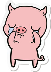 sticker of a cartoon pig crying