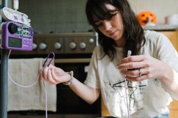 A woman with a feeding tube at home