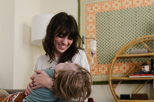 Mother with a baby who needs food through the tube at home