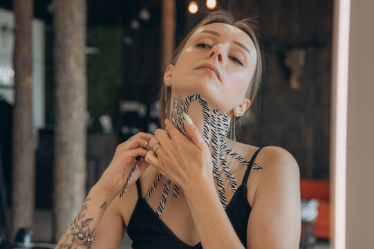 Woman putting kinesio tape on neck