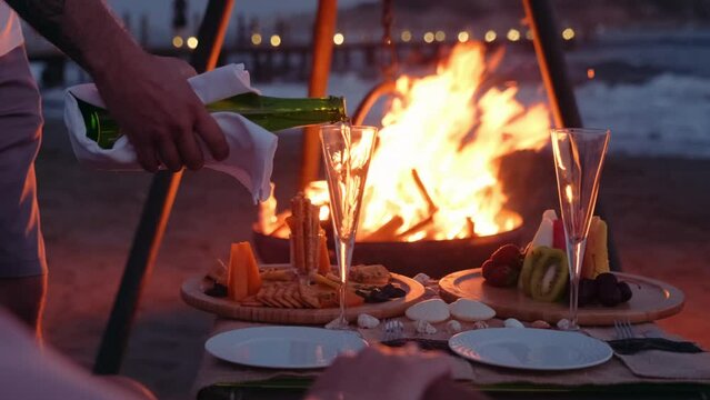 White wine Romantic evening by the fire on the beach
