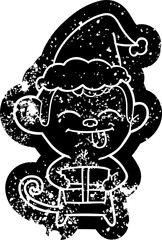 funny cartoon distressed icon of a monkey with christmas present wearing santa hat