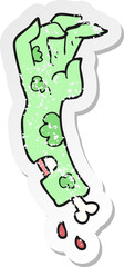 retro distressed sticker of a cartoon zombie arm