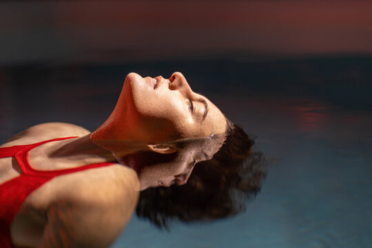 Graceful Lady In Scarlet Dress Posing In Water