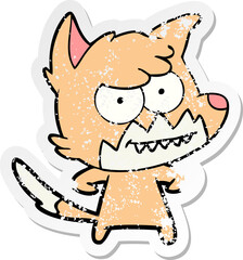 distressed sticker of a cartoon grinning fox