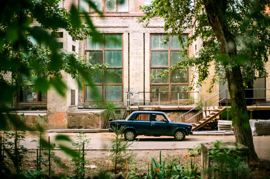 Vintage car in the background of a constructivist building