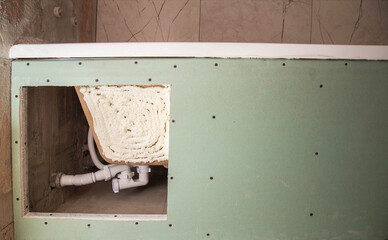 Renovation in the bathroom, installation of a new acrylic bathtub. Foaming bath foam. Technological...