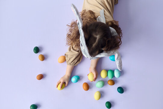Kid with colored eggs