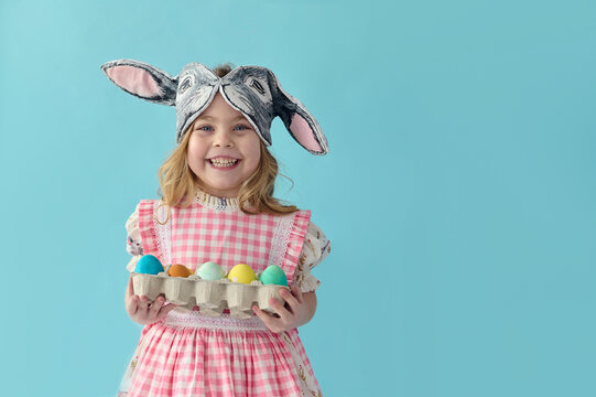 happy child with an eggs container