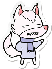 sticker of a cartoon wolf in winter clothes