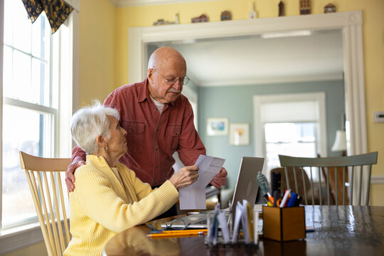 Wife and husband organized finance review paper bills 