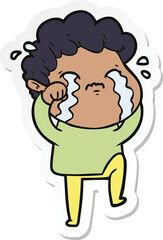 sticker of a cartoon man crying