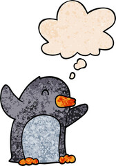cartoon excited penguin and thought bubble in grunge texture pattern style