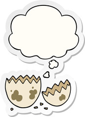 cartoon cracked egg and thought bubble as a printed sticker