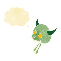 cartoon spooky skull with thought bubble