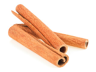 Aromatic dry cinnamon sticks isolated on a white background. Seasoning and flavoring.